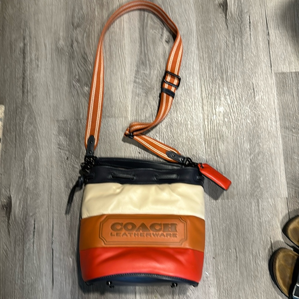 Like new Coach leather ware large crossbody purse. multi colored. No flaws.